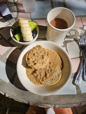 Plant based sausage and gravy with fruit cup and chai latte at Hibiscus Cafe in Grayton Beach