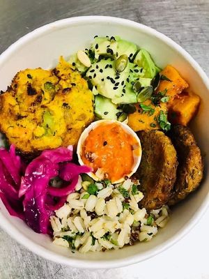 Vegan Buddha Bowl with Sweet Potato and Broccoli Muffin, Butternut Squash Falafel, pickled cabbage, avocado, brown basmati rice, quinoa and beetroot hummus. at Mo's Diner in Ir-rabat Ghawdex