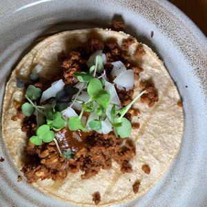 Fancy Impossible Chorizo: Impossible Meat, Spices, Toasted Pine Nuts, Onions, Micro-Cilantro.  From Vegan Taco Tuesday 11/14/23 (every 2nd Tuesday of the month) at 600 Kitchen and Bar in Kalamazoo
