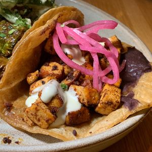 Crispy Seasoned Tofu Taco: Refried Black Beans, Pickled Onions, Vegan Cilantro Aioli.  From Vegan Taco Tuesday 12/12/23 (every 2nd Tuesday of the month) at 600 Kitchen and Bar in Kalamazoo