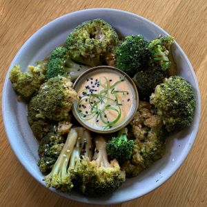 Charred Sesame Broccoli:  Orange Zest, Sesame Seeds, Roasted Garlic, Calabrian Chili Oil, Gochujang Aioli at 600 Kitchen and Bar in Kalamazoo