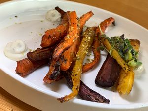 Glazed, Oven-Roasted Heirloom Carrots: Vegan Dijonaise, Pistachios, Micro-Greens, OMIT Hot Honey at 600 Kitchen and Bar in Kalamazoo