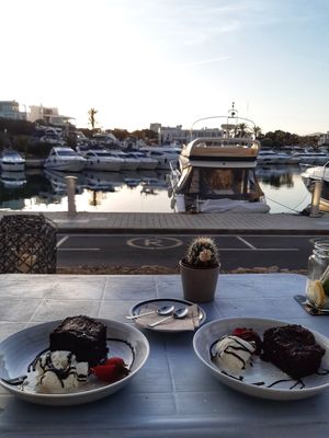 Vegan brownie with vanilla ice cream at Boat House Bar in Mallorca