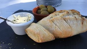 Crunchy bread with olives and homemade vegan aioli at Boat House Bar in Mallorca