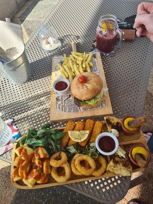 Onion rings, "fish sticks", sausages, potato, peppers and potato tortilla. at Boat House Bar in Mallorca