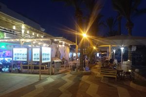 Outdoor seating with harbour view at Boat House Bar in Mallorca