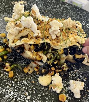 Potato with popcorn and black olives — wow 🤩   at Plantae Gastrobar  in Tenerife