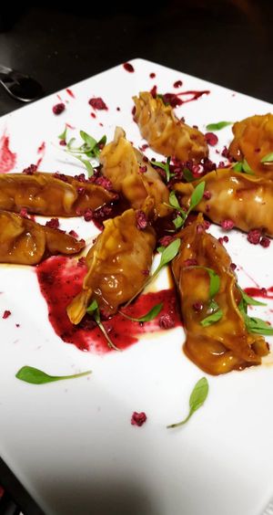 Gyozas de kimchi con salsa de frambuesa y ajo negro  at Plantae Gastrobar  in Tenerife