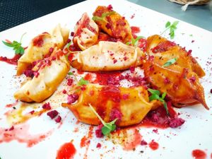Gyozas de kimchi con salsa de frambuesa y ajo negro  at Plantae Gastrobar  in Tenerife