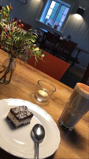 Chai latte with oat milk and one of the many raw vegan cakes at Café Zorn in Mora