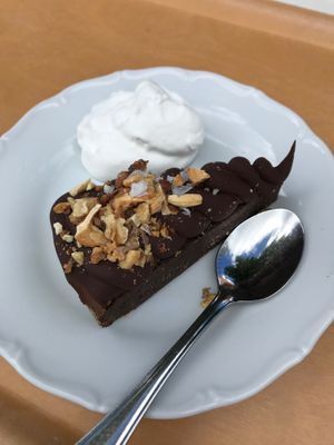 Vegan chocolate cake with soy cream at Café Zorn in Mora