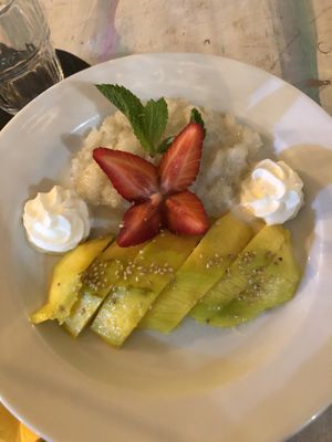 Mango sticky rice (ask to hold the whipped cream for vegan)  at Yoya's Thai Kitchen in Albufeira