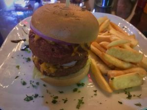 The epic double Beyond Burger with vegan cheeze and chips. at Front Bar in Munxar