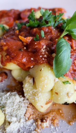 vegan gnocchi bolognese with homemade vegan parmesan 💚🌱👌🏻  at Planet One in Arbon