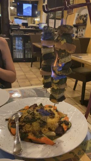 The vegan main with kebabs (freshly aflame)   at A Braijade Meridiounale in Menton