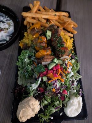 Plato de 2 brochetas: una de "pollo" y una de "cordero" at Sham - Mont Royal in Montreal