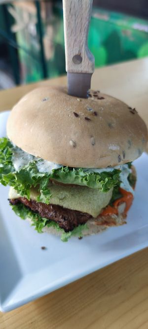 August burger with soy patty. I liked the knife on top. at Veganbar in Bremen