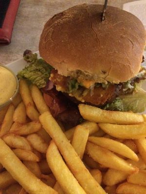 BigSchmeck burger with vegan bacon, fried vegan cheese and seitan patty at Veganbar in Bremen