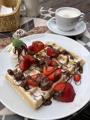 Vegan Waffle with vegan vanilla ice, vegan chocolate spread/sauce and strawberries.  at Kleines Waffelhaus in Luebeck