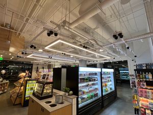 Tables in shared space with Choice Market, which has more security cameras than you can imagine! at Wellness Sushi in Denver