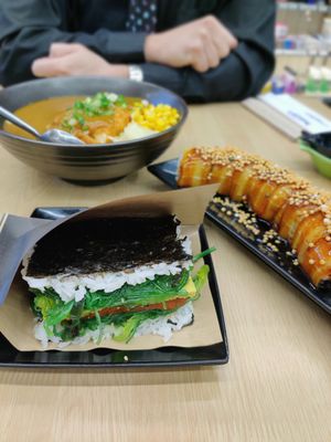 Tofu Katsu Curry Don, Smoky Sake roll, and Seabreeze Onigiri at Wellness Sushi in Denver
