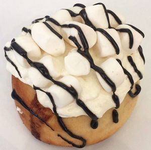 Orange Creamsicle Roll! Orange Cream Frosting, Marshmallows, and Chocolate Sauce!  at Cinnaholic in Dunwoody