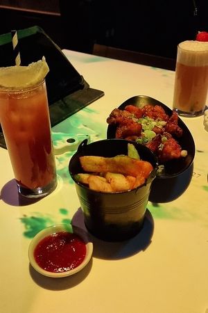 Chunky chips & Bang bang cauliflower in a sweet and spicy sauce at Inamo - Soho in London