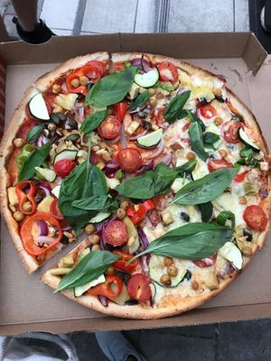 Vegan pizza (left side) - half of it shared with a vegetarian who added cheese to it (right side) at Blondo's Pizza in Hamburg