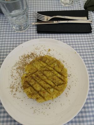 Pie of yellow potatoes with onions and wild fennel flower  at Bistro Miranda in Orvieto