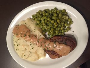 Steak mashed potatoes sweet peas at Quannies Vegan Dishes  in Fort Lauderdale