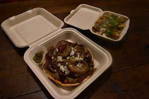 Candiac pizza and poutine delivered in their eco-friendly packaging! ☺️ at Chez Valerie 셰 발레리 in Seoul