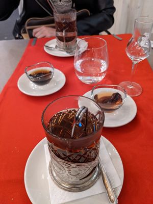 Tea served with sugary quince and walnut sweets. at Hachapuri in Budapest