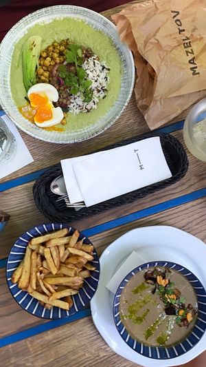 vegetarian hummus bowl (top) & fries and vegan lentil soup (bottom) at Mazel Tov in Budapest