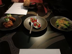 Left to right. Spiced fries cauliflower. Tomberries, cashew cream, basil verde. Shishito peppers, Ponzi, sesame at Rogue Bistro in Newstead