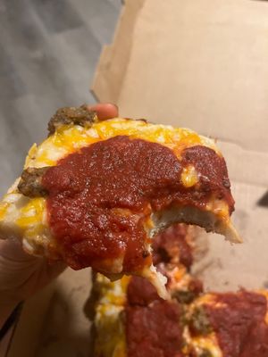 Slice of vegan deep dish pizza  at Satch Squared in Gainesville