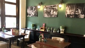 old photos on the walls with images of world cuisine at Stoof in Sneek