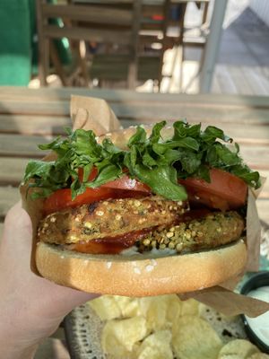 The vegan burger “The Mikala”. It comes with vegan mayo and chips. at Café Braetspil in Haslev