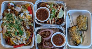 (left to right) nachos, buffalo cauliflower tacos, fish tacos, street corn at Jajaja Mexicana - Hudson Yards in New York City