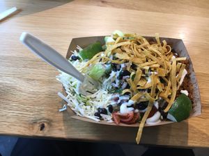 Vegan bowl; notice cardboard "plate" and plastic fork at Jajaja Mexicana - Hudson Yards in New York City
