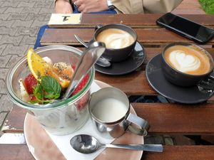 Yoghurt with granola and fruits, and capuccino's with oat milk at Plan Cafe in Berlin