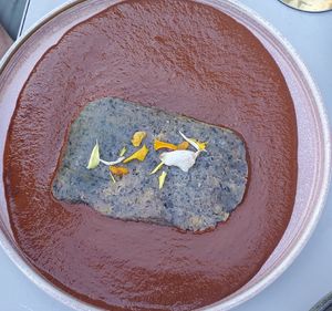 Red mole tamale at La Bartola in Toronto