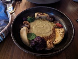 Pistachio pepian with an assortment of uncommon veg at La Bartola in Toronto