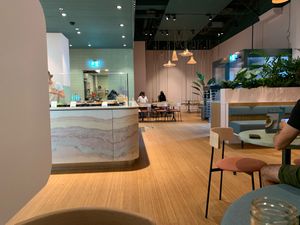 bowl preparation area with a part of the seating area including two fun tables with swings for chairs  at SESH in Wallisellen