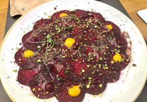 Beetroot carpaccio with pistachio and mango salsa ( vegan ) at Aromatic Restaurant in Altafulla