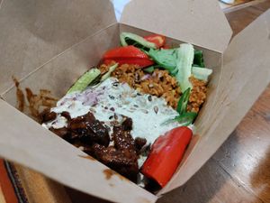 Sweet seitan, corn rice, grilled and fresh vegetables at Vegan Place in Tbilisi