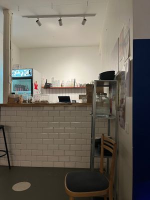 Counter with a small selection of sweets (cookies and cinnamon rolls) on the left. at Vegan Place in Tbilisi