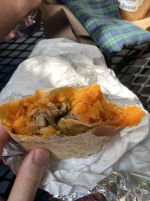 Breakfast burrito with sausage, potatoes, cheese, and pickled jalapeños   at Little Barn Coffee House in Los Angeles