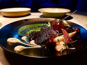 Roasted Red Moon, Comfit Vegetables, black garlic tuille
 at Oliveira Kitchen in East London