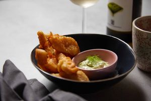 Blossom Tempura
The blossoms of banana plant, battered in a plant-based naturally gluten-free tempura served with vegan tartare sauce.  at Oliveira Kitchen in East London