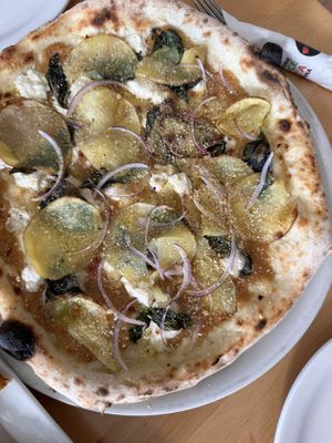 The PATATE 2.0 pizza. If you love roasted garlic u will love this!  at Pizzeria Grano in Vancouver